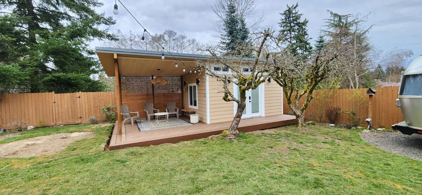 Completed single-story backyard room addition with a covered patio