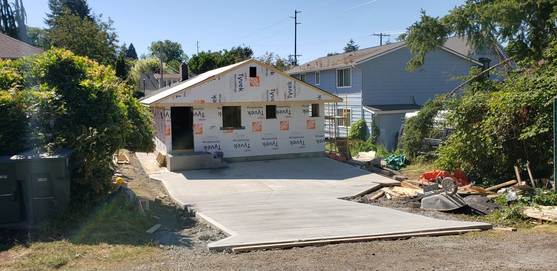 New detached backyard structure with finished concrete apron
