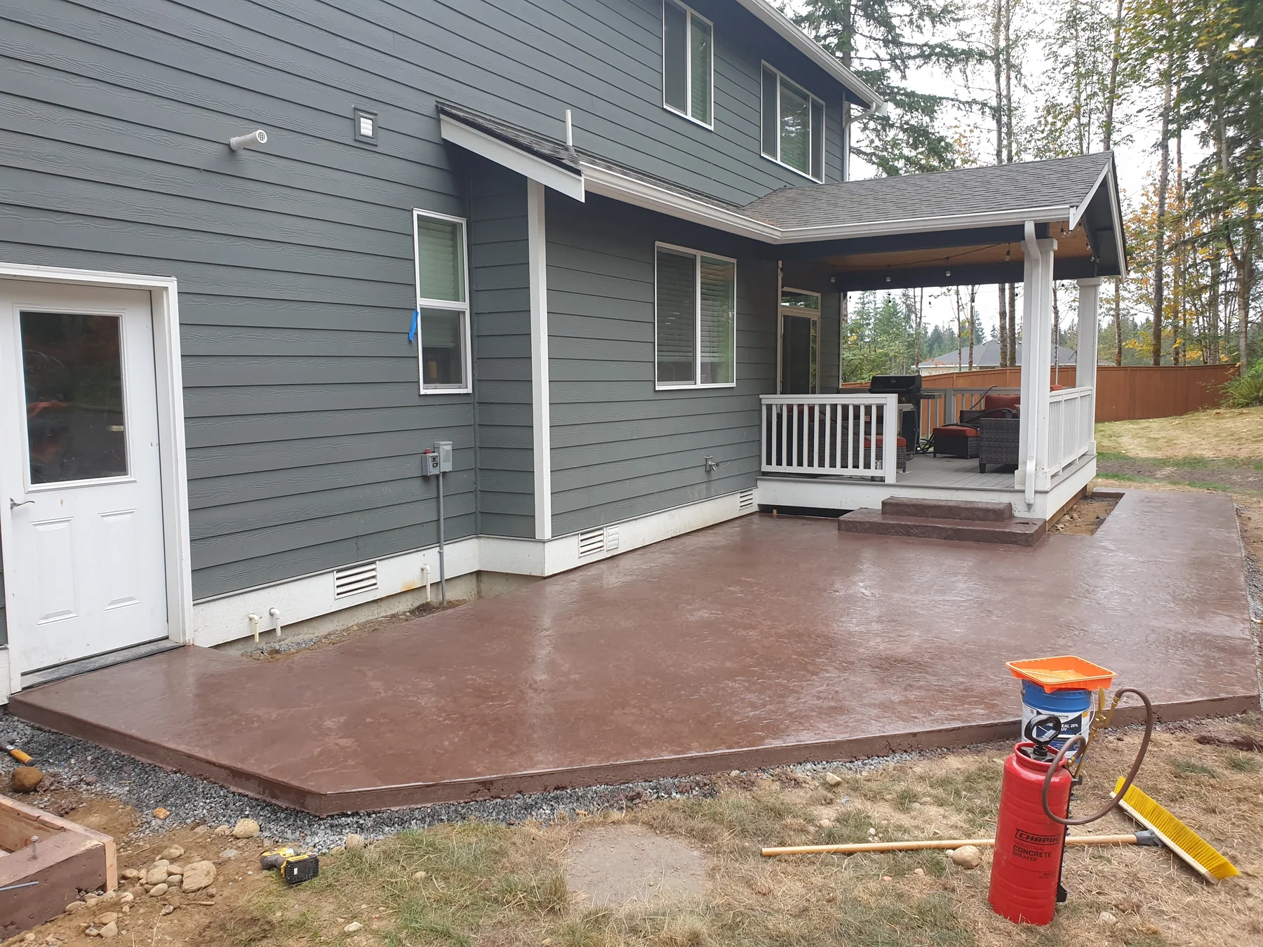 Stamped concrete patio and curved steps built by Grizzly