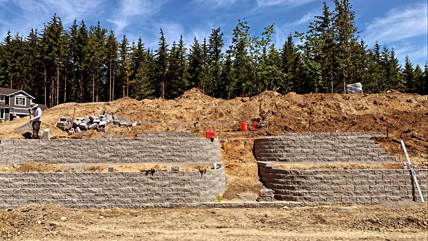 Large finished terraced retaining wall system on a sloped residential site